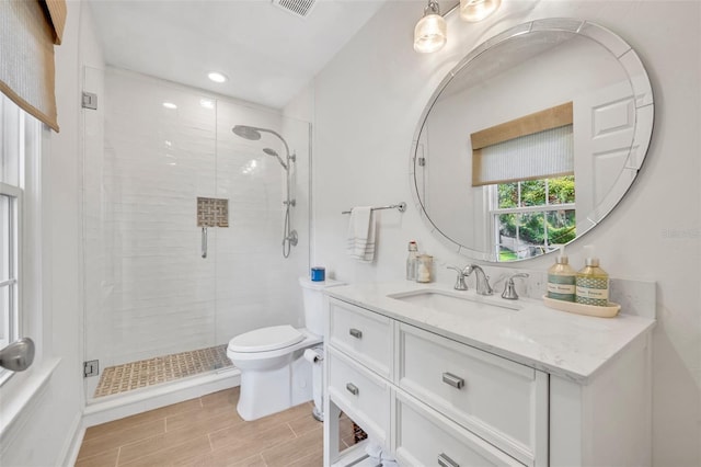 624 Richmond St, Orlando, FL 32806 - full bathroom with vanity, a stall shower, wood tiled floors, and recessed lighting