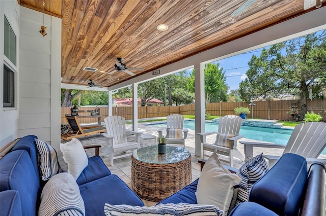 624 Richmond St, Orlando, FL 32806 - fenced backyard with outdoor lounge area, a ceiling fan, and a patio area