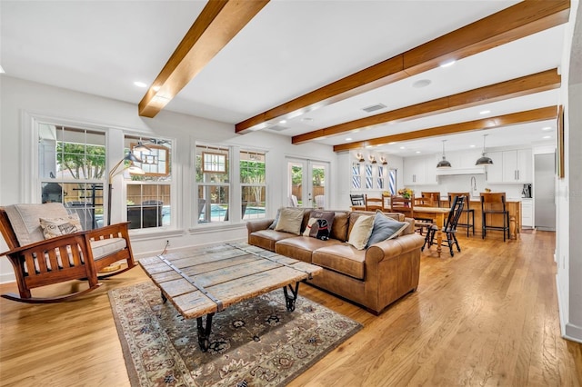 624 Richmond St, Orlando, FL 32806 - living room with healthy amount of natural light, light wood-style flooring, beamed ceiling, and recessed lighting