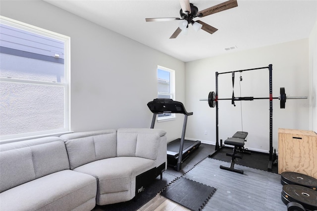 5677 Cedar Chase Dr, Saint Cloud, FL 34771 - workout room with wood finished floors and a ceiling fan