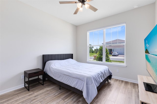 5677 Cedar Chase Dr, Saint Cloud, FL 34771 - bedroom with wood finished floors and a ceiling fan