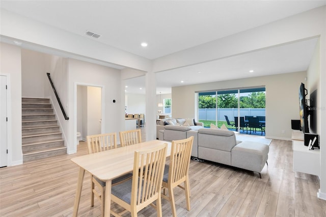 5677 Cedar Chase Dr, Saint Cloud, FL 34771 - dining room with light wood-style floors, stairway, and recessed lighting