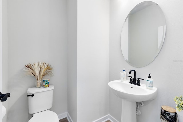 5677 Cedar Chase Dr, Saint Cloud, FL 34771 - half bathroom featuring toilet and baseboards