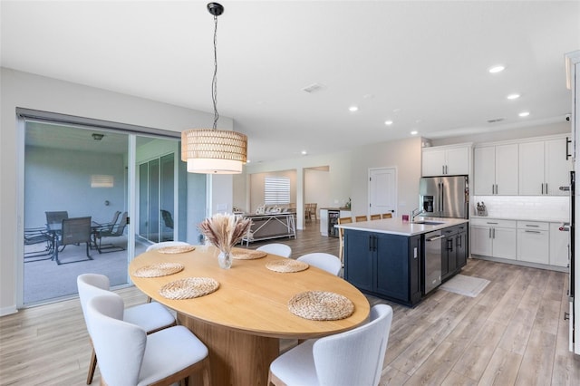 5677 Cedar Chase Dr, Saint Cloud, FL 34771 - dining space with light wood finished floors and recessed lighting