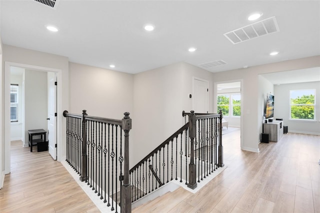 5677 Cedar Chase Dr, Saint Cloud, FL 34771 - corridor with an upstairs landing, light wood-style floors, plenty of natural light, and recessed lighting