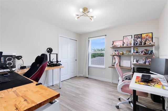 5677 Cedar Chase Dr, Saint Cloud, FL 34771 - office space featuring a chandelier, light wood-style flooring, and a textured ceiling
