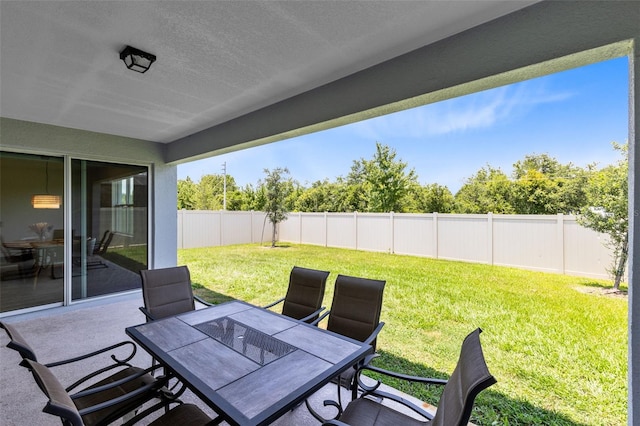 5677 Cedar Chase Dr, Saint Cloud, FL 34771 - fenced backyard with outdoor dining space