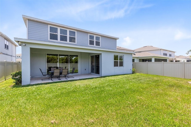 5677 Cedar Chase Dr, Saint Cloud, FL 34771 - rear view of house with a patio, a fenced backyard, and stucco siding