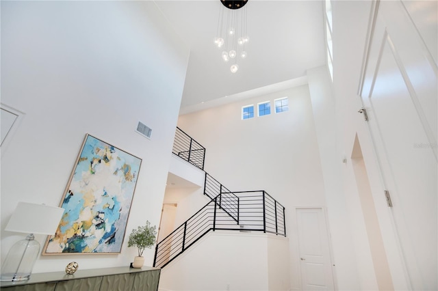 14189 Larkspur Lake Dr, Winter Garden, FL 34787 - stairway featuring a towering ceiling