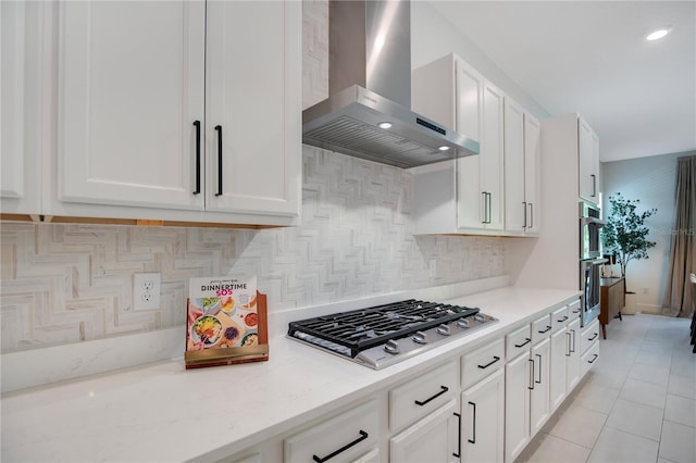 14189 Larkspur Lake Dr, Winter Garden, FL 34787 - kitchen with wall chimney exhaust hood, stainless steel appliances, white cabinetry, and recessed lighting