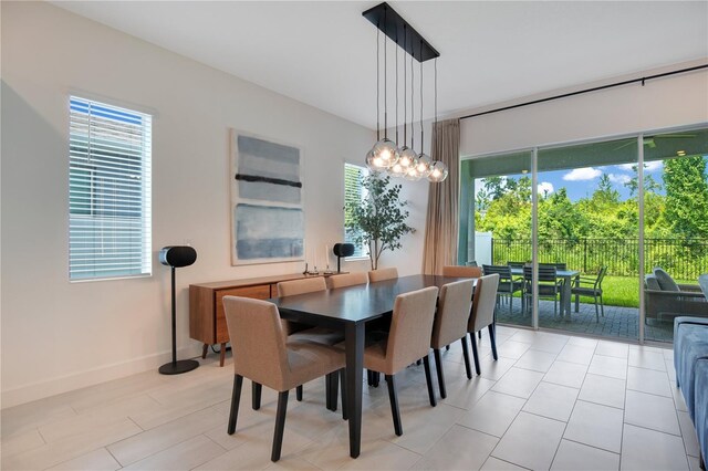 14189 Larkspur Lake Dr, Winter Garden, FL 34787 - dining space with baseboards and a chandelier