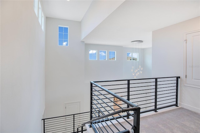 14189 Larkspur Lake Dr, Winter Garden, FL 34787 - staircase featuring carpet floors and a chandelier