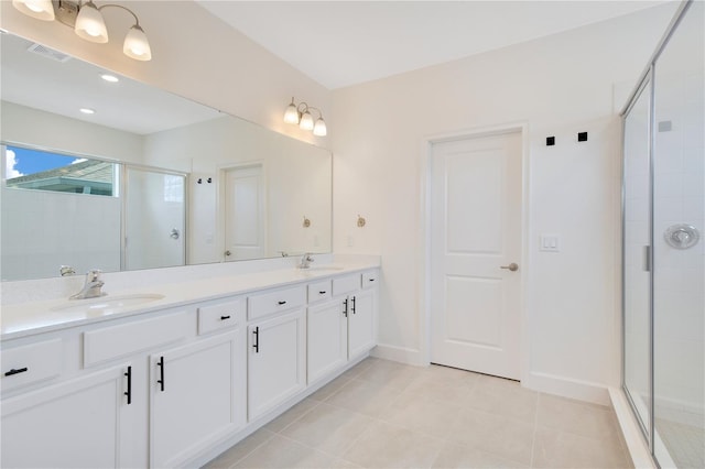 14189 Larkspur Lake Dr, Winter Garden, FL 34787 - full bathroom featuring double vanity, a shower stall, and tile patterned flooring