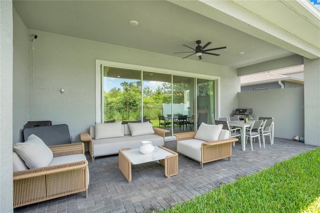 14189 Larkspur Lake Dr, Winter Garden, FL 34787 - view of patio featuring outdoor dining space, ceiling fan, and an outdoor living space