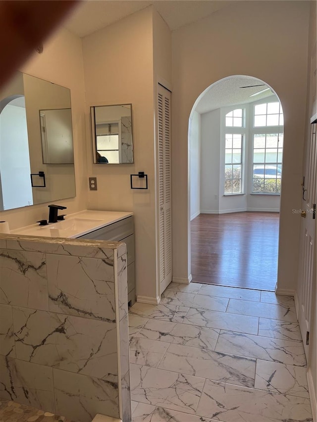 2421 Queenswood Cir, Kissimmee, FL 34743 - bathroom with vanity, marble look tile flooring, and a closet