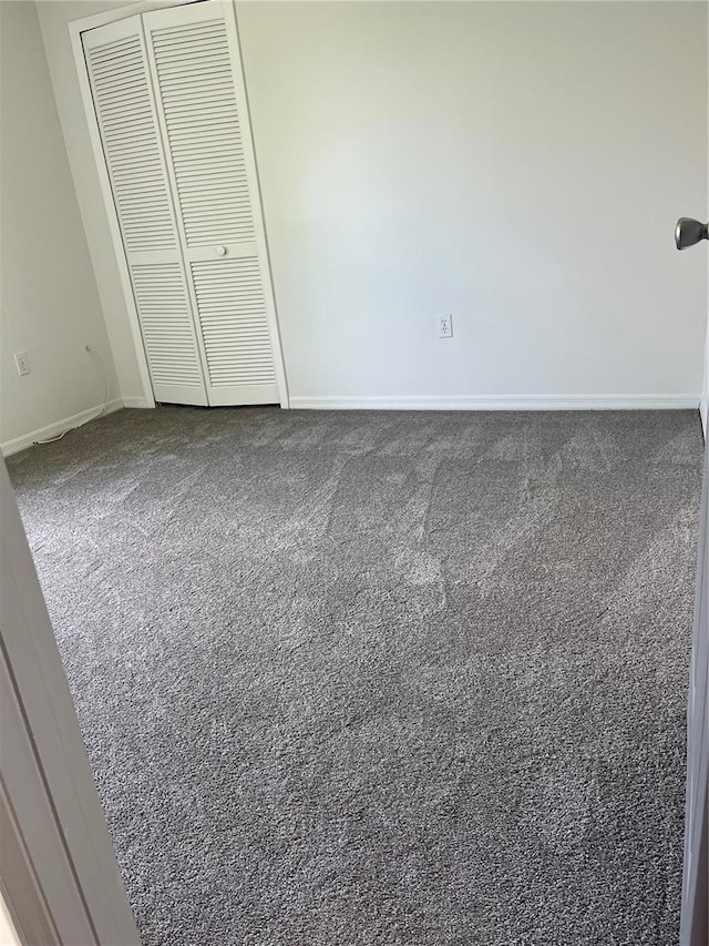 2421 Queenswood Cir, Kissimmee, FL 34743 - unfurnished bedroom featuring carpet floors and a closet