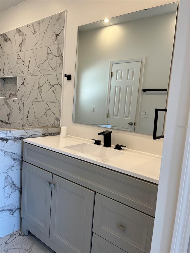 2421 Queenswood Cir, Kissimmee, FL 34743 - bathroom with marble look tiles and vanity