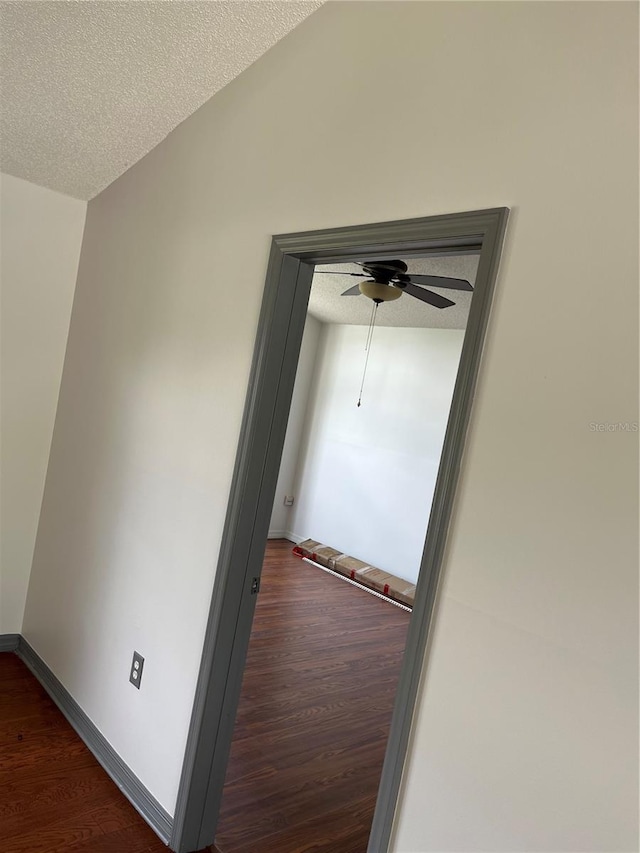 2421 Queenswood Cir, Kissimmee, FL 34743 - hall with a textured ceiling and dark wood finished floors