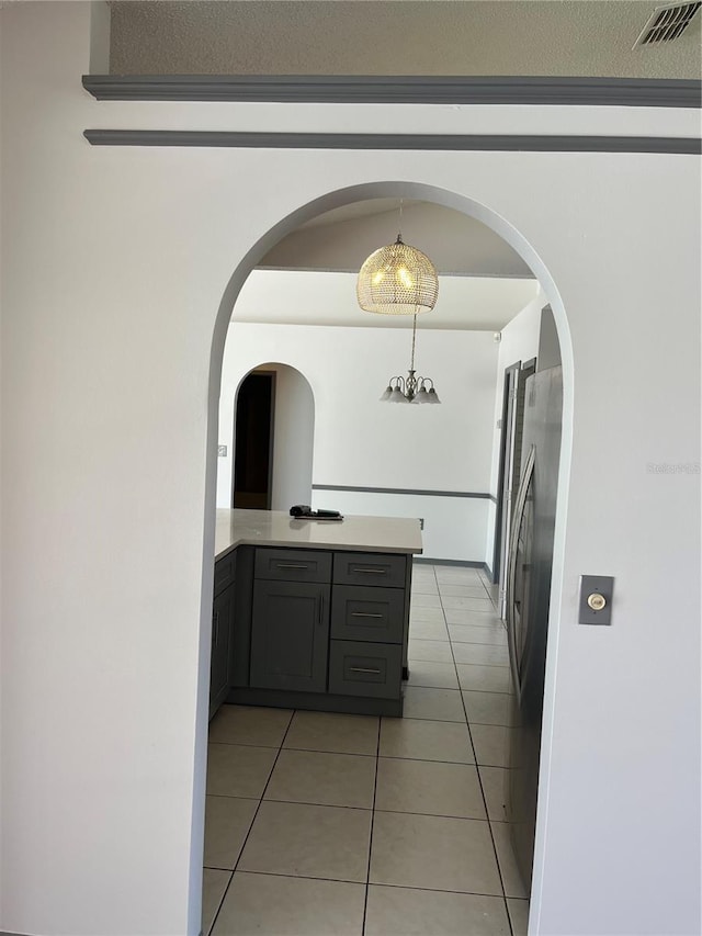 2421 Queenswood Cir, Kissimmee, FL 34743 - corridor featuring light tile patterned flooring and arched walkways
