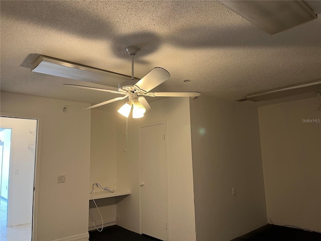 2421 Queenswood Cir, Kissimmee, FL 34743 - spare room with a textured ceiling and a ceiling fan