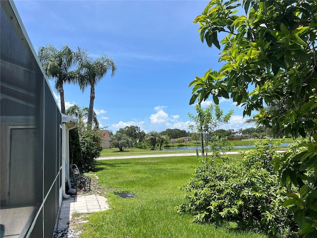 2421 Queenswood Cir, Kissimmee, FL 34743 - view of green lawn featuring a water view