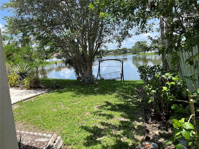 2421 Queenswood Cir, Kissimmee, FL 34743 - view of green lawn featuring a water view