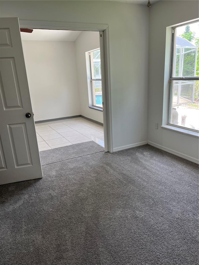 2421 Queenswood Cir, Kissimmee, FL 34743 - unfurnished room featuring light tile patterned floors and light carpet