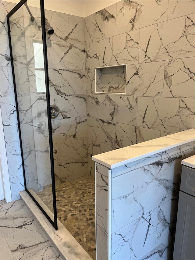 2421 Queenswood Cir, Kissimmee, FL 34743 - full bath with a marble finish shower, marble look tile flooring, and vanity