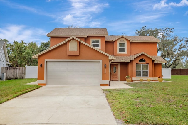 traditional-style house featuring stucco siding, concrete driveway, and an attached garage