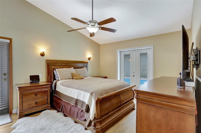 bedroom with access to exterior, french doors, lofted ceiling, light wood-style flooring, and ceiling fan