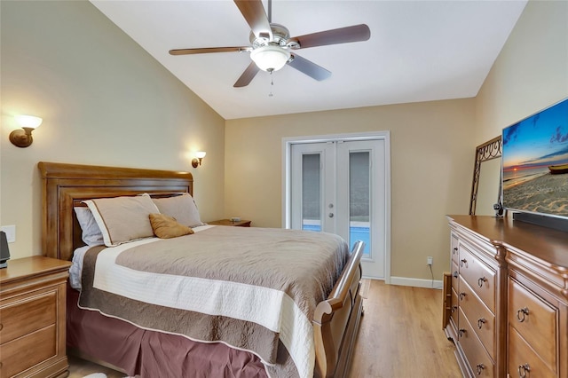 bedroom with french doors, access to exterior, light wood-style flooring, a ceiling fan, and lofted ceiling
