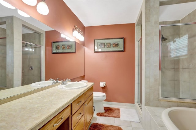full bath featuring tile patterned flooring, a stall shower, a garden tub, and vanity