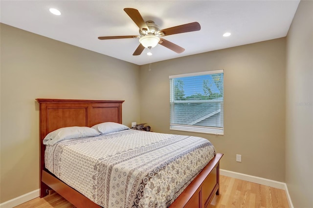 bedroom with light wood-type flooring, recessed lighting, and ceiling fan