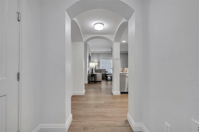 14501 Grove Resort Ave Unit 3239, Winter Garden, FL 34787 - hall featuring light wood finished floors and arched walkways