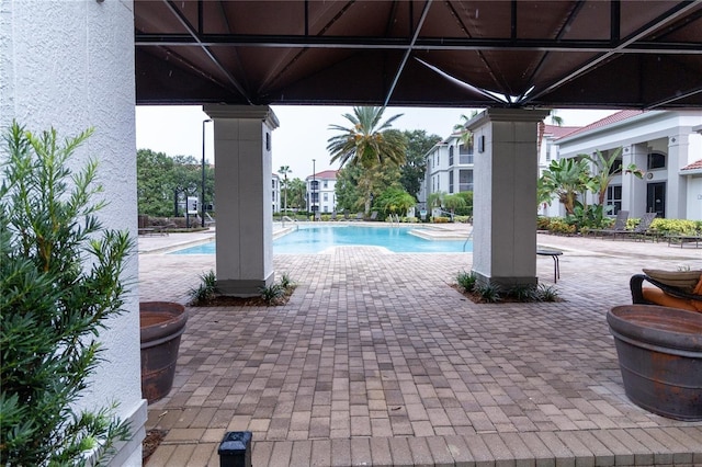 2525 Maitland Crossing Way Unit 202, Orlando, FL 32810 - community pool featuring a patio area