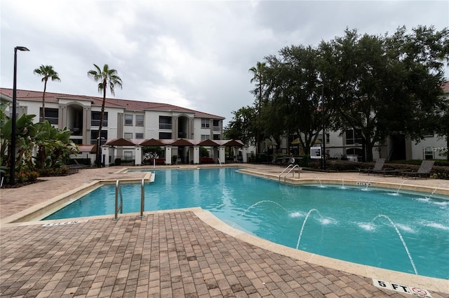 2525 Maitland Crossing Way Unit 202, Orlando, FL 32810 - community pool featuring a patio