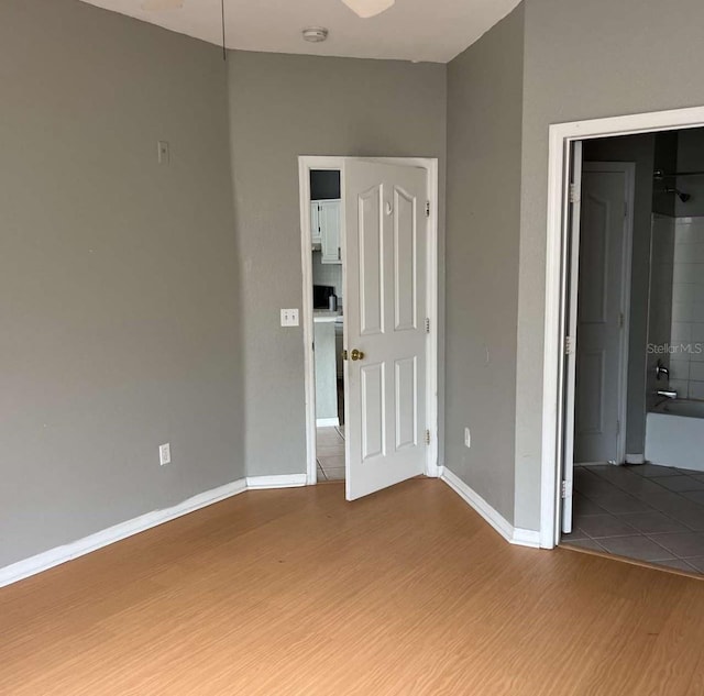 2525 Maitland Crossing Way Unit 202, Orlando, FL 32810 - unfurnished bedroom with wood finished floors and baseboards
