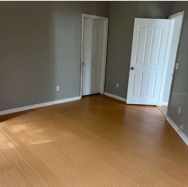 2525 Maitland Crossing Way Unit 202, Orlando, FL 32810 - unfurnished room with wood finished floors and baseboards