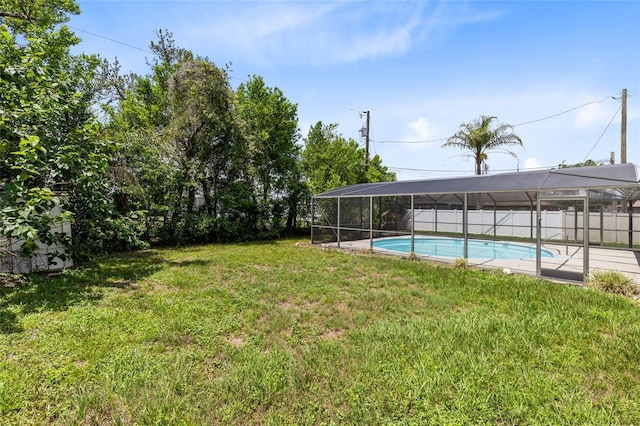 1736 Saxon Blvd, Deltona, FL 32725 - fenced backyard featuring a lanai