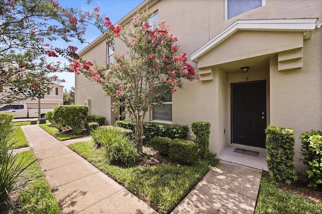 3537 Seneca Club Loop Unit B, Orlando, FL 32808 - view of exterior entry with stucco siding