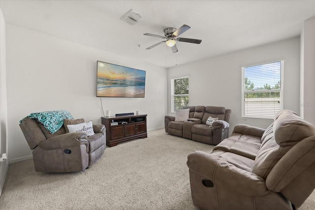 3537 Seneca Club Loop Unit B, Orlando, FL 32808 - living area with carpet floors, a ceiling fan, and baseboards