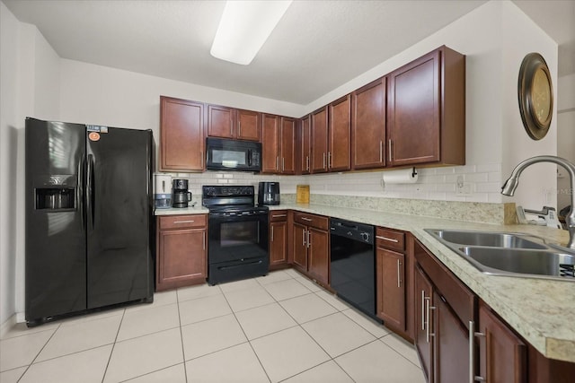 3537 Seneca Club Loop Unit B, Orlando, FL 32808 - kitchen featuring black appliances, a sink, light countertops, decorative backsplash, and light tile patterned floors