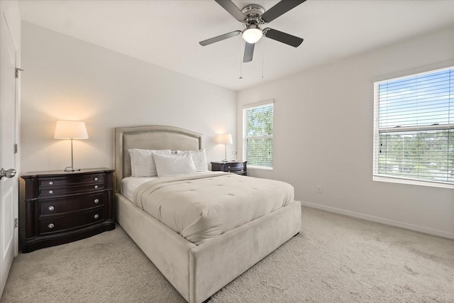 3537 Seneca Club Loop Unit B, Orlando, FL 32808 - bedroom featuring light carpet, baseboards, and ceiling fan