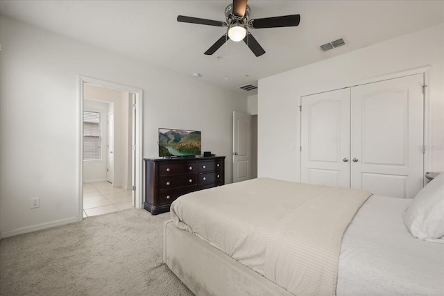3537 Seneca Club Loop Unit B, Orlando, FL 32808 - tiled bedroom with carpet, baseboards, a closet, and ceiling fan