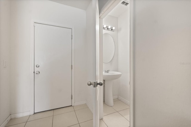 3537 Seneca Club Loop Unit B, Orlando, FL 32808 - bathroom featuring tile patterned flooring and baseboards