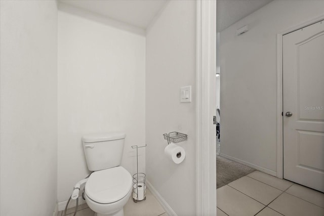 3537 Seneca Club Loop Unit B, Orlando, FL 32808 - bathroom with toilet, baseboards, and tile patterned floors