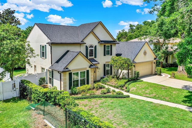 991 Hawthorne Cove Ct, Ocoee, FL 34761 - view of front of house featuring stucco siding, concrete driveway, an attached garage, and roof with shingles