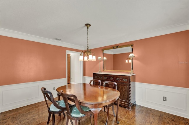 991 Hawthorne Cove Ct, Ocoee, FL 34761 - dining room with wainscoting, ornamental molding, wood finished floors, and a chandelier