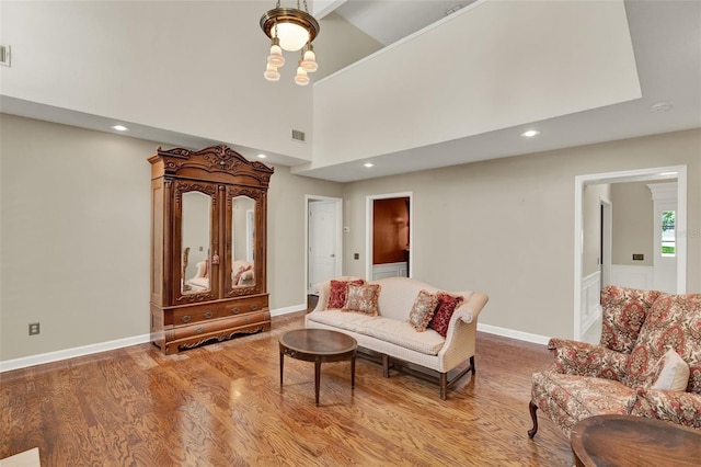 991 Hawthorne Cove Ct, Ocoee, FL 34761 - living room featuring light wood-type flooring, recessed lighting, and a high ceiling