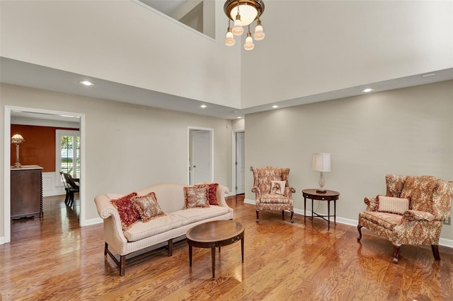 991 Hawthorne Cove Ct, Ocoee, FL 34761 - living room with light wood-style floors, recessed lighting, a chandelier, and a towering ceiling